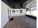 Screened in patio with tile floors, ceiling fan, and views of the backyard at 1211 Lehigh St, Kissimmee, FL 34744