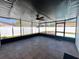 Enclosed patio with tiled flooring, ceiling fan, and view of the pool at 1211 Lehigh St, Kissimmee, FL 34744