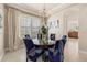 A dining room features a round table, decorative chairs and a chandelier at 1225 Radiant St, Reunion, FL 34747
