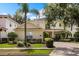 Charming two-story home featuring a well-manicured lawn and lush landscaping enhancing curb appeal at 1225 Radiant St, Reunion, FL 34747