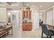 An elegant foyer features a built-in bar, tile floors and access to a spacious living area at 1225 Radiant St, Reunion, FL 34747