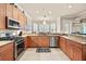 Well-equipped kitchen with a stainless steel oven and granite countertops at 1225 Radiant St, Reunion, FL 34747