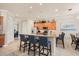 Spacious kitchen with granite countertops, stainless steel appliances, and bar seating at 1225 Radiant St, Reunion, FL 34747