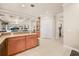 Open kitchen layout with granite countertops and access to the living room and dining area at 1225 Radiant St, Reunion, FL 34747