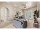Upstairs living area offers a cozy spot to relax with comfortable furnishings and outdoor access at 1225 Radiant St, Reunion, FL 34747