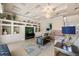 Comfortable living room with coffered ceilings, custom shelving, and an open layout at 1225 Radiant St, Reunion, FL 34747