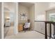 The office nook features a desk, chair, and railing with a view of the backyard at 1225 Radiant St, Reunion, FL 34747