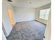 Spacious bedroom with gray carpet and walk-in closet at 1370 Holodak Dr, Davenport, FL 33837