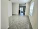 Hallway featuring gray tile floor leading to the main living area at 1370 Holodak Dr, Davenport, FL 33837