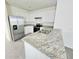Modern kitchen with stainless steel appliances and granite countertops at 1370 Holodak Dr, Davenport, FL 33837