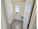 A cozy laundry room with a window for natural light at 1370 Holodak Dr, Davenport, FL 33837