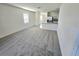 Open-concept living room flowing into kitchen with large window at 1370 Holodak Dr, Davenport, FL 33837