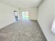 Spacious carpeted living room with lots of natural light at 1370 Holodak Dr, Davenport, FL 33837