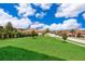 Expansive backyard with lush green lawn and meticulously maintained landscaping at 1776 Bella Lago Dr, Clermont, FL 34711