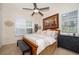 Bedroom with a king bed, shutters, and a neutral color scheme at 1776 Bella Lago Dr, Clermont, FL 34711
