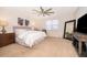 Bright and airy primary bedroom with ceiling fan, large mirror, and a serene atmosphere at 1776 Bella Lago Dr, Clermont, FL 34711