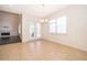Bright dining room with large windows, chandelier, and neutral tile flooring at 1776 Bella Lago Dr, Clermont, FL 34711