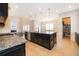Gourmet kitchen with center island, granite counters, stainless appliances, and an open layout at 1776 Bella Lago Dr, Clermont, FL 34711