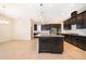 Gourmet kitchen featuring a large island, granite countertops, and stainless steel appliances at 1776 Bella Lago Dr, Clermont, FL 34711