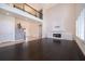 Bright living room featuring hardwood floors, fireplace, and staircase at 1776 Bella Lago Dr, Clermont, FL 34711