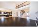 Open-concept living area showcasing staircase, kitchen, and ample natural light at 1776 Bella Lago Dr, Clermont, FL 34711