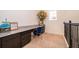 Upstairs workspace with granite countertop, desk, and drawers; features a large window at 1776 Bella Lago Dr, Clermont, FL 34711