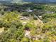 A picturesque estate surrounded by dense woodlands, providing privacy and a serene environment at 1781 Terra Verde Ln, Chuluota, FL 32766