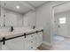 Modern bathroom featuring a double vanity with white cabinets, and plank flooring at 1781 Terra Verde Ln, Chuluota, FL 32766
