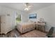 Charming bedroom with a ceiling fan, wood-look floors, a rug, and natural light at 1781 Terra Verde Ln, Chuluota, FL 32766