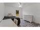Bright bedroom featuring a ceiling fan, window, wood-look floors, and white painted furniture at 1781 Terra Verde Ln, Chuluota, FL 32766
