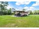 A large open carport provides covered parking for various vehicles and equipment on the spacious property at 1781 Terra Verde Ln, Chuluota, FL 32766