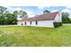 A well-maintained home exterior featuring a basketball hoop, two-car garage and manicured lawn at 1781 Terra Verde Ln, Chuluota, FL 32766