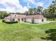 Lovely home with a lush green lawn, accented by trees and manicured landscaping at 1781 Terra Verde Ln, Chuluota, FL 32766