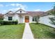 Stunning home with beautiful landscaping and a charming entryway at 1781 Terra Verde Ln, Chuluota, FL 32766