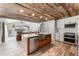 Bright, open kitchen featuring stainless steel appliances and a rustic ceiling that adds character at 1781 Terra Verde Ln, Chuluota, FL 32766