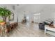 Bright open-concept living and dining areas, featuring wood-look tile flooring and natural light at 1781 Terra Verde Ln, Chuluota, FL 32766