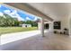 An expansive covered patio overlooks the sprawling backyard and a white outbuilding at 1781 Terra Verde Ln, Chuluota, FL 32766