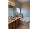 Bright bathroom with double vanity, a soaking tub, and ample counter space, providing a luxurious feel at 2106 Congress Ln, St Cloud, FL 34769