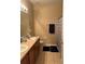 Neutral bathroom with double sink vanity, tile flooring, and shower with decorative curtain at 2106 Congress Ln, St Cloud, FL 34769