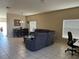 Spacious living room featuring neutral walls, tile floors, and comfortable seating with a dining area at 2106 Congress Ln, St Cloud, FL 34769
