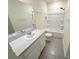 Bathroom showcases a modern vanity with a sink, mirror, and a toilet and shower/bath combo at 2278 Tay Wes Dr, St Cloud, FL 34771