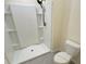 Bathroom featuring a clean white shower, neutral paint, and new toilet at 2278 Tay Wes Dr, St Cloud, FL 34771