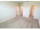 Spacious bedroom boasts plush carpeting, multiple doors, and ample closet space at 2278 Tay Wes Dr, St Cloud, FL 34771