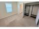 Bedroom featuring plush carpets, natural lighting, closet space, and an en-suite bathroom at 2278 Tay Wes Dr, St Cloud, FL 34771
