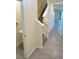 Bright entryway with tiled flooring, staircase, and convenient half bathroom at 2278 Tay Wes Dr, St Cloud, FL 34771