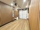 Finished garage with wood laminate floors and overhead garage door at 2278 Tay Wes Dr, St Cloud, FL 34771