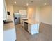 Spacious kitchen featuring an island, white cabinets, and stainless steel appliances at 2278 Tay Wes Dr, St Cloud, FL 34771