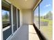 Screened patio with ample space for outdoor seating and entertainment, overlooking the backyard at 2278 Tay Wes Dr, St Cloud, FL 34771