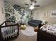 Bright Bedroom with whimsical decor and a comfortable seating area at 2436 Gratia Pl, Casselberry, FL 32707