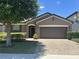 Charming single-story home featuring a brick driveway and well-maintained landscaping at 2436 Gratia Pl, Casselberry, FL 32707